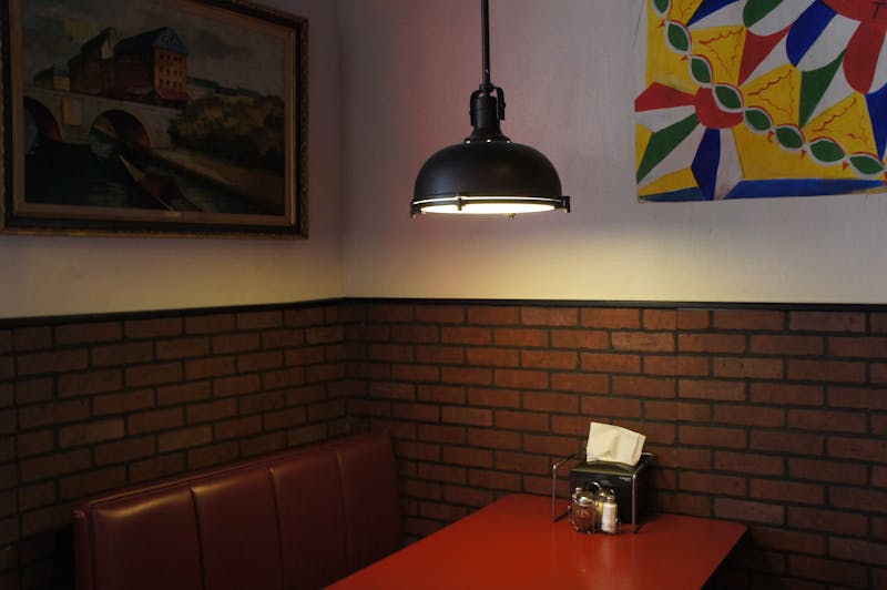 Inside Anthony's Coal Fired Pizza - warm, inviting dining room atmosphere